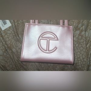 Im selling the small teflar bag ballerina pink it’s the limited edition one.